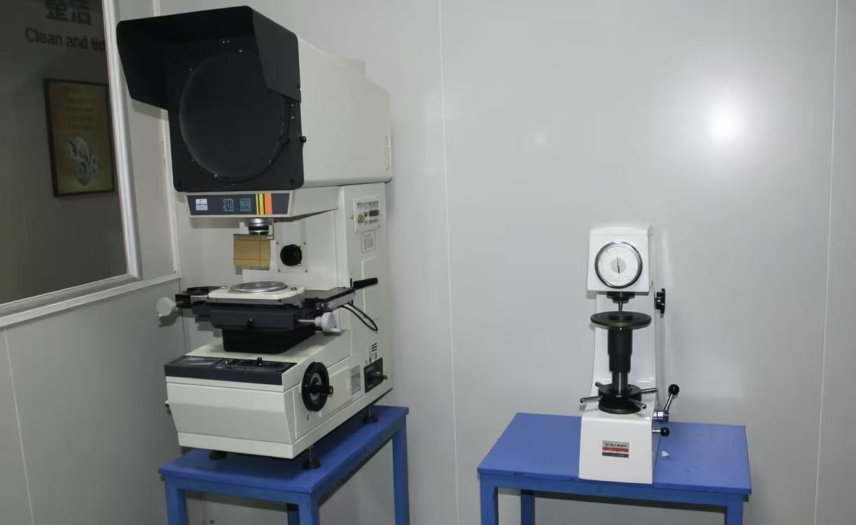 Metrology room with optical projector and Rockwell hardness tester